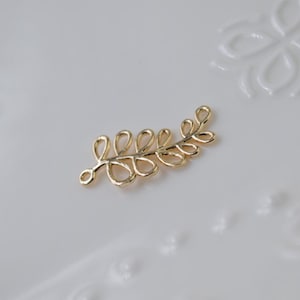 5 of gold leaf charm