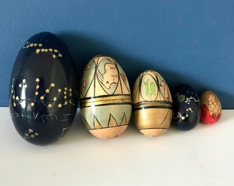 Vintage wooden nesting eggs zodiac star signs.