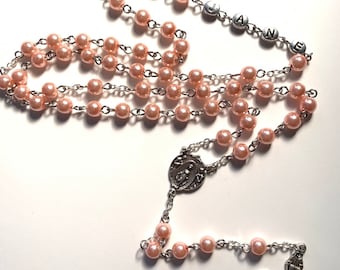 Personalized rosary will personalize up to 10 letters your choice of color of your beads.  Letters are silver tone