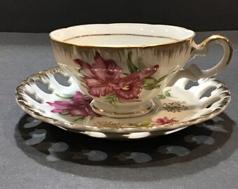 Porcelain Tea Cup and Saucer, Decorated with Pink Iris, Reticulated Saucer and Gold Accents