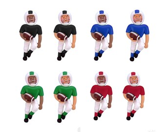 May include: Set of ten miniature football players in various team colors, including black, blue, green, and red. Each player is holding a football and wearing a helmet.