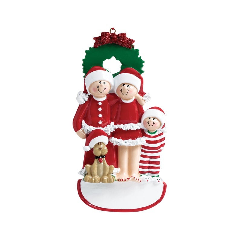 May include: A Christmas ornament featuring a family of three in red and white pajamas, standing in front of a green wreath. A small dog is standing in front of them. The ornament has a blank space for personalization.