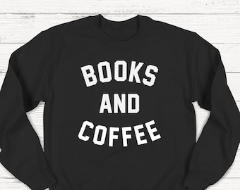 May include: Black sweatshirt with white text that reads "BOOKS AND COFFEE".
