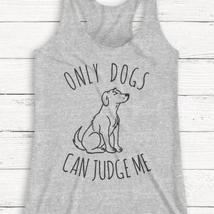 May include: Gray heather tank top with the text "Only dogs can judge me" and a black and white illustration of a dog sitting.