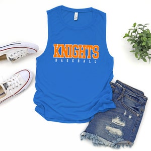 May include: A royal blue sleeveless tank top with the words "Knights Baseball" printed in orange and white letters.