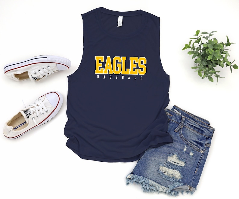 May include: A navy blue sleeveless tank top with the words "Eagles Baseball" in yellow letters.