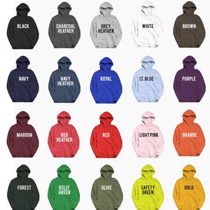 May include: A display of hooded sweatshirts in various colors, including black, charcoal heather, grey heather, white, brown, navy, navy heather, royal, lt. blue, purple, maroon, red heather, red, light pink, orange, forest, kelly green, olive, safety green, and gold. The text "HOODED SWEATSHIRTS GROUND COLORS" is at the top.