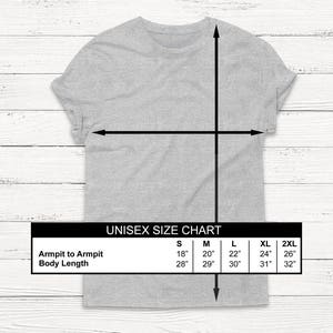 May include: Unisex size chart for a t-shirt with measurements in inches for armpit to armpit and body length. Sizes include S, M, L, XL, and 2XL.