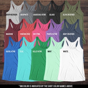 May include: A variety of tank tops in different colors, including gray heather, graphite, charcoal heather, black, olive heather, maroon, vintage red, hot pink, purple heather, navy heather, royal heather, teal, kelly heather, mint, and white. The text "* INK COLOR IS INDICATED BY THE SHIRT COLOR NAMES ABOVE" is at the bottom of the image.