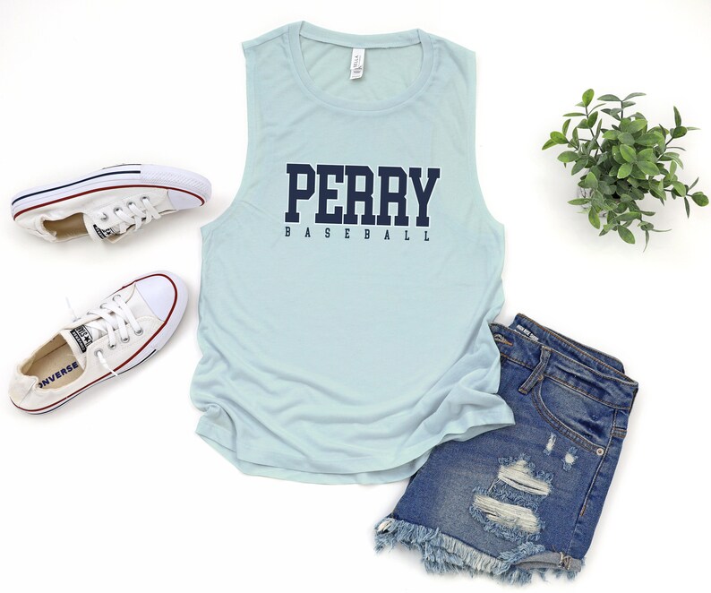 May include: Light blue sleeveless tank top with the text "PERRY BASEBALL" in navy blue lettering.