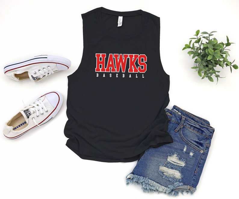 May include: Black sleeveless tank top with the words "HAWKS BASEBALL" in red letters.