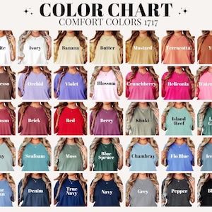May include: A color chart displays a variety of Comfort Colors t-shirts in various shades. The chart includes colors like white, blue jean, and black, with the text "COLOR CHART COMFORT COLORS 1717" at the top.