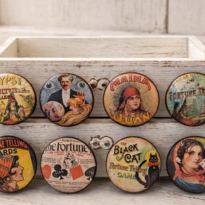 May include: A set of three ceramic mugs with a speckled, matte finish. The mugs are in shades of cream, light gray, and dark gray. Each mug has a simple, minimalist design and a rounded handle.