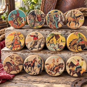 May include: A set of twelve circular wooden knobs featuring colorful vintage-style illustrations of cowboys, horses, and desert landscapes. Each knob displays a unique scene of western life, including riders on horseback and cacti in warm tones.