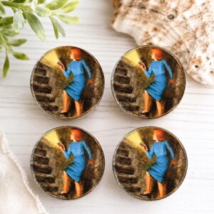 May include: Four circular buttons featuring a vintage-style illustration of a person with red hair wearing a blue dress and holding a flashlight while walking up a dark stone staircase. The image shows a bright beam of light illuminating the steps.