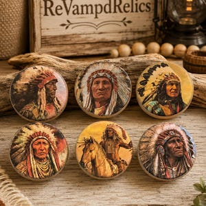 May include: Six round cabinet knobs featuring detailed color illustrations of Native American figures in traditional headdresses. Five knobs depict portraits of individuals, while one knob shows a figure on horseback. Each knob has a smooth finish.