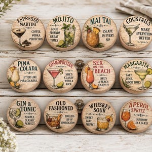 May include: Wooden cocktail coasters with various drink names and illustrations, including Espresso Martini, Mojito, Mai Tai, and Cocktails. Each coaster features a unique design and text, perfect for home bars.