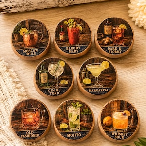May include: Set of eight round wooden coasters featuring cocktail illustrations. Drinks include Moscow Mule, Bloody Mary, Dark & Stormy, Gin & Tonic, Margarita, Old Fashioned, Mojito, and Whiskey Sour. Each coaster has a unique design with drink ingredients.