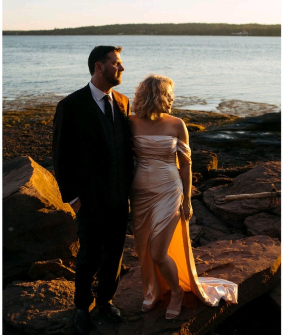 champagne wedding dress what color tuxedo I know I want my bridesmaids to wear neutral champagne dresses, but not  sure what suit color to pair with them... help!   #neutralbridesmaiddresses #weddingparty #bridalparty #groomsuit  #groomsmensuit #bridesmaiddresses #weddingplanning