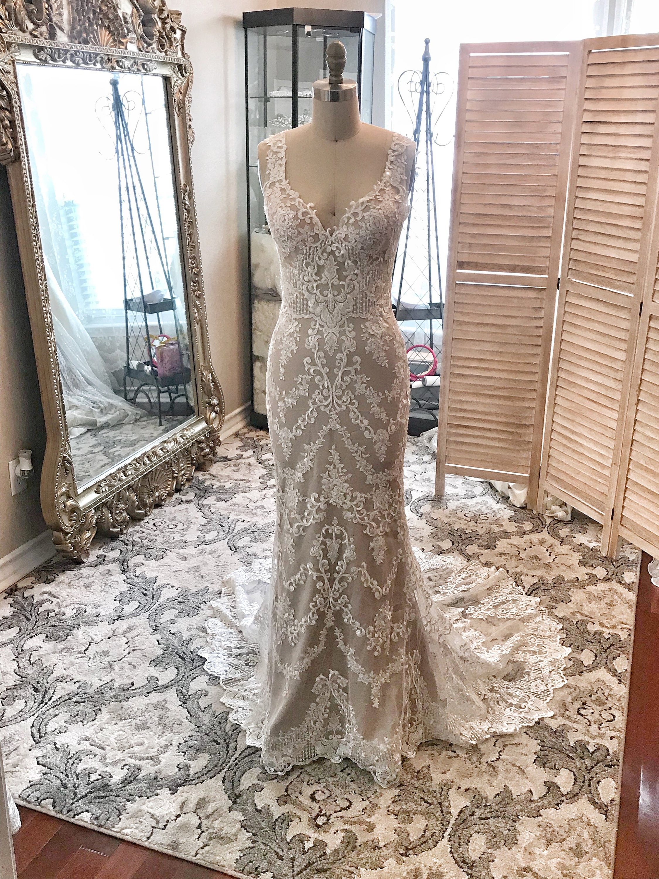 beaded scalloped wedding dress Dale by Lazaro brings a refined kind of romance., Beaded lace, a sculpted shape, and delicate scalloped detail create a look that feels both timeless and quietly striking. | Lazaro