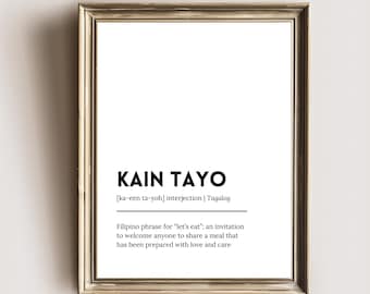 May include: A black and white printable wall art print with the Filipino phrase "kain tayo" which means "let's eat" in English. The print also includes the pronunciation and definition of the phrase.