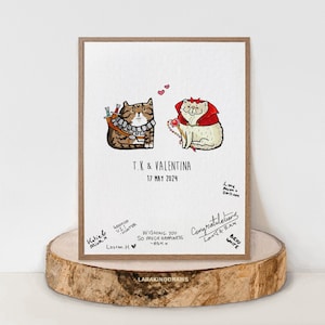 May include: A white card with a hand-drawn illustration of two cats dressed up as a knight and a queen. The card has the text "T.K & VALENTINA 17 MAY 2024" and several handwritten messages.