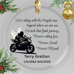 May include: A clear glass ornament featuring a motorcycle graphic and the text "He's riding with the Angels now...Forever Missed." The ornament includes the name "Terry Gretton" and dates 1/6/1962-9/4/2025.