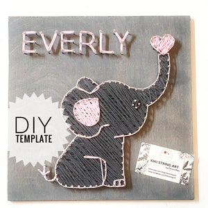 May include: DIY string art template featuring a gray elephant with a pink heart and the name "EVERLY" on a gray wooden background.