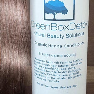 May include: GreenBox Detox Organic Henna Conditioner bottle with a green label and white text. The label features a green tree logo and the text "Strength Shine Bounce". The bottle is 8 oz. and is for all hair types that are dry.