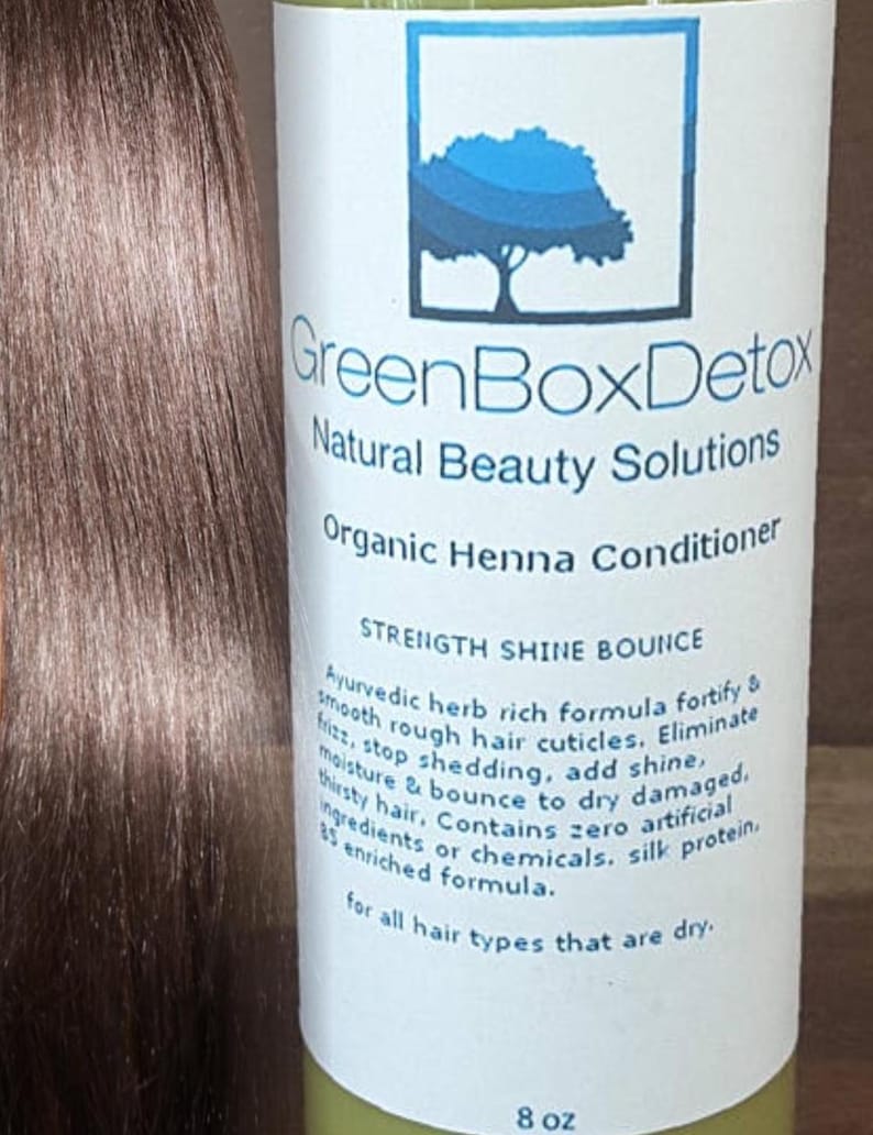 May include: GreenBox Detox Organic Henna Conditioner bottle with a green label and white text. The label features a green tree logo and the text "Strength Shine Bounce". The bottle is 8 oz. and is for all hair types that are dry.