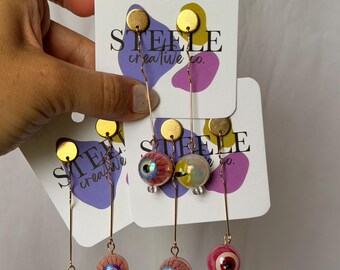 Spooky Mismatch Eyeball Dangly Earrings