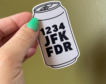 May include: A white can sticker with black text that reads "1234 JFK FDR".