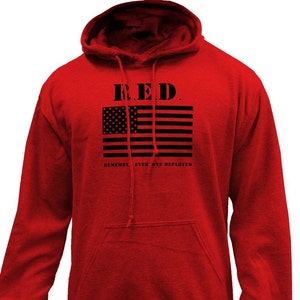 May include: A red hooded sweatshirt with a front pocket and drawstring. The front features a black American flag design with the text "R.E.D." above and "Remember Everyone Deployed" below.