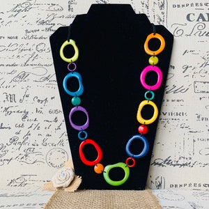 Rainbow statement necklace Tagua necklace Geometric jewelry Donut shape bead Spring fashion trends Anniversary gifts Lightweight adjustable