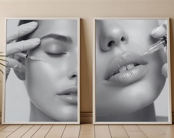 May include: Two framed black and white wall art prints depicting close-up portraits of a face receiving cosmetic injections. One print shows a needle near the eye area, while the other shows a needle near the lips, both held by gloved hands.