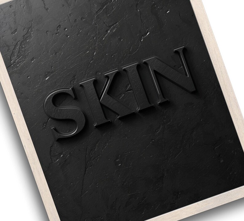 Minimalist printable wall art featuring the word "SKIN" embossed on a lightly textured, black concrete-style background, perfect for esthetician, dermatology office, med spa, or skincare gift decor.