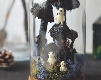 Terrarium with black mushrooms and Kodama ghosts glowing in the dark - decoration under the glass dome