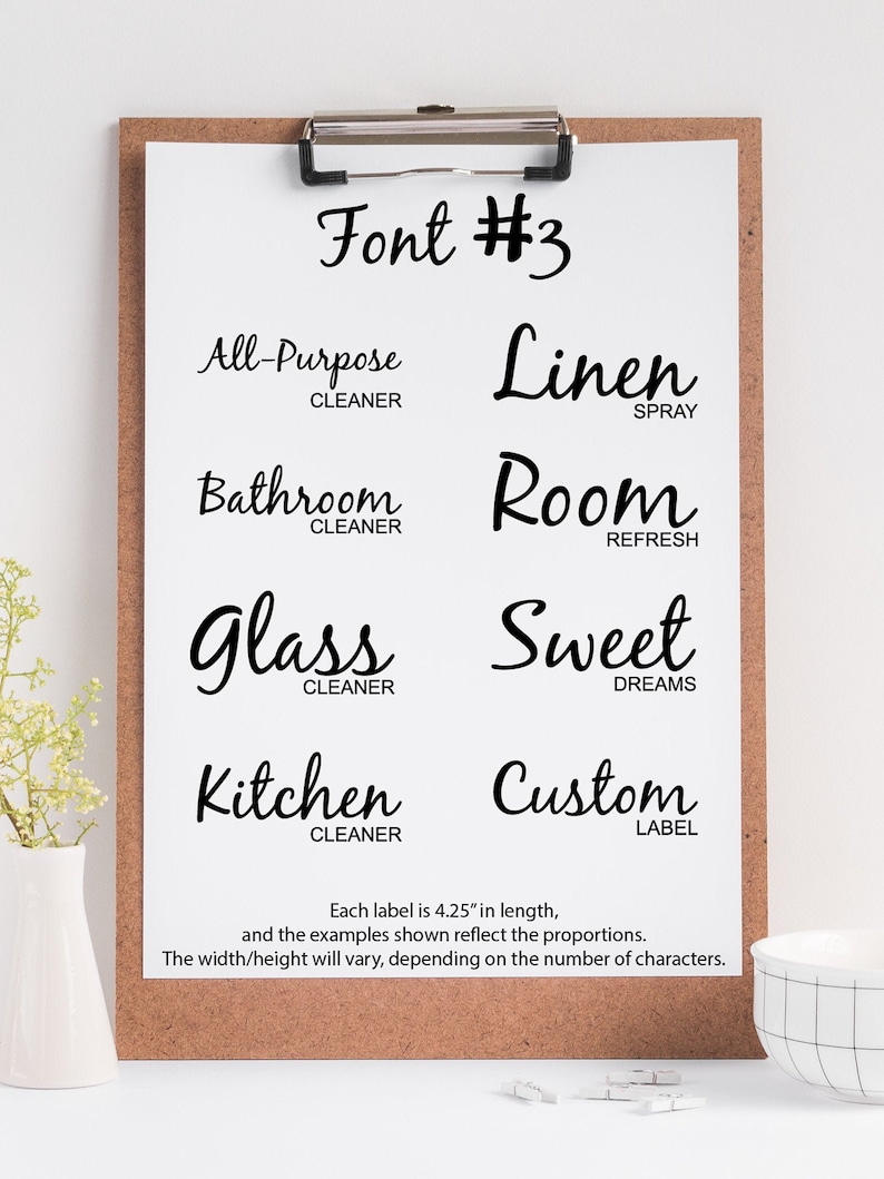 May include: A black and white image of a font style guide for labels. The font is a cursive script style. The text reads "Font #3" and includes examples of labels for "All-Purpose Cleaner", "Linen Spray", "Bathroom Cleaner", "Room Refresh", "Glass Cleaner", "Sweet Dreams", "Kitchen Cleaner", and "Custom Label". Each label is 4.25 inches long.