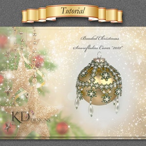 May include: A beaded Christmas ornament with a gold base and green and white beads. The ornament is decorated with snowflake designs and has a beaded fringe. The ornament is labeled "Beaded Christmas Snowflakes Cover 2021".