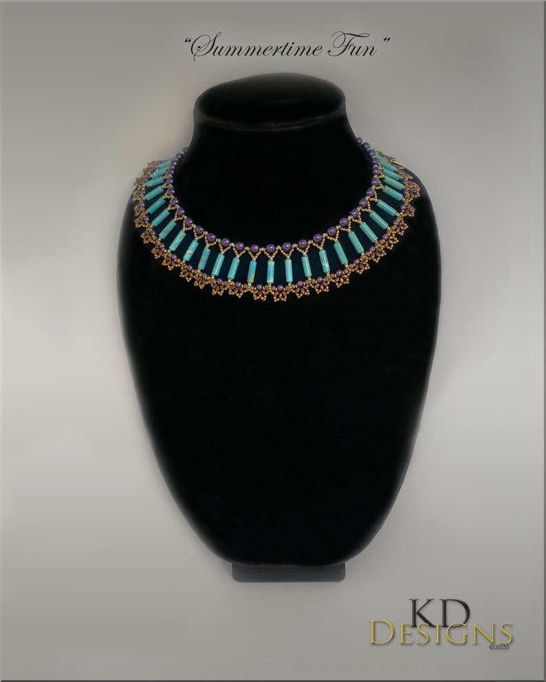 May include: A turquoise and purple beaded necklace with a gold-colored metal accent. The necklace is on a black display stand. "Summertime Fun" is written above the necklace.