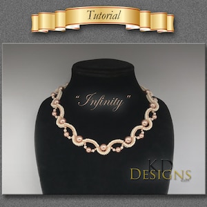 May include: A beaded necklace with a delicate, infinity-shaped design. The necklace is made with white and pink beads and is displayed on a black mannequin.