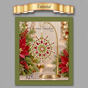 May include: A beaded snowflake ornament in red, green, and white, hanging from a gold metal stand. The text reads Tutorial, Christmas Snowflake 2019, and KD Designs. The ornament features a circular pattern with faceted red and green beads.