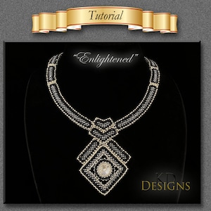 May include: A black and gold beaded necklace with a large, square pendant featuring a clear crystal. The pendant is surrounded by smaller black beads. The necklace is on a black velvet display stand. The text "Enlightened" is above the necklace and "KD DESIGNS" is below the necklace.