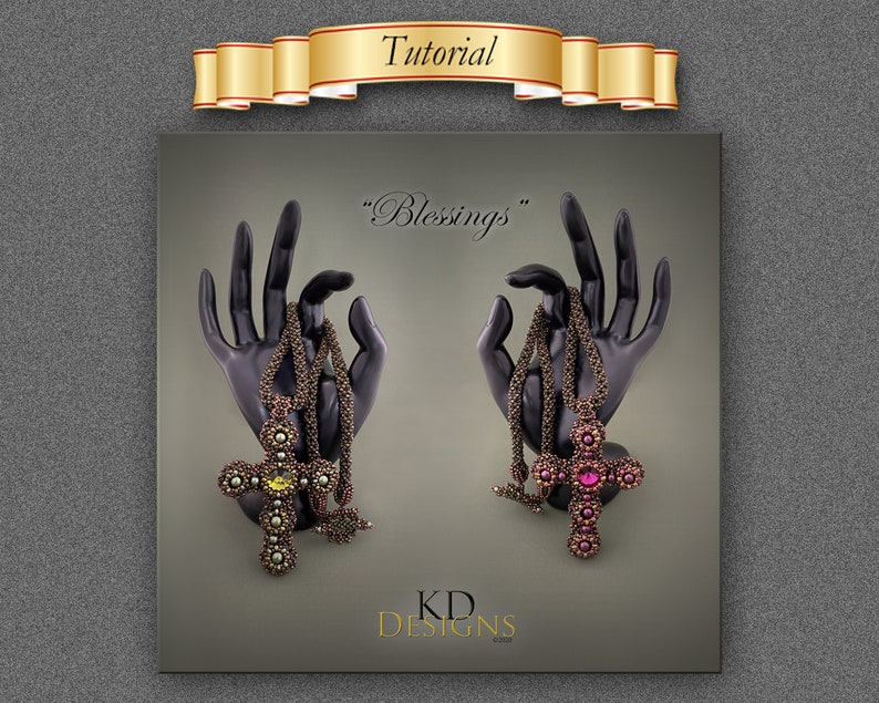 May include: Two beaded cross necklaces with a pink and yellow gemstone in the centre. The necklaces are displayed on black hands with the text "Blessings" above them and "KD DESIGNS" below them.