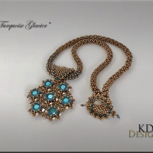 May include: A gold beaded necklace with a turquoise gemstone pendant. The pendant is shaped like a snowflake and has a "Turquoise Glacier" inscription.