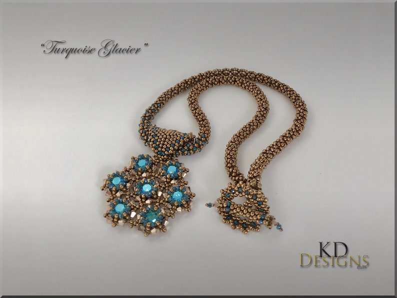 May include: A gold beaded necklace with a turquoise gemstone pendant. The pendant is shaped like a snowflake and has a "Turquoise Glacier" inscription.
