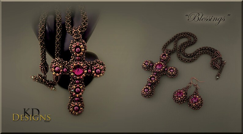 May include: A beaded cross necklace and earrings set in a dark brown and burgundy colour scheme. The necklace features a large cross pendant with a large burgundy gemstone in the centre. The earrings are teardrop shaped with a burgundy gemstone in the centre. The set is labelled "Blessings".