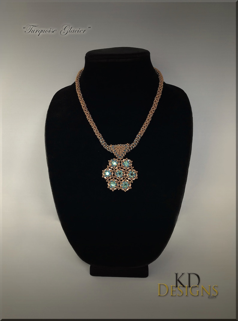 May include: A copper and turquoise beaded necklace with a large pendant featuring a flower design with turquoise stones. The necklace is displayed on a black stand. The text "KD DESIGNS &copy;2019" is visible in the bottom right corner of the image.