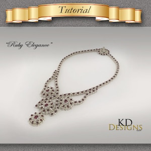 Op de afbeelding: Een zilveren ketting met een dubbelstrengs ontwerp en rode kristallen accenten. De ketting heet "Ruby Elegance" en is een sieradenontwerp van KD Designs.