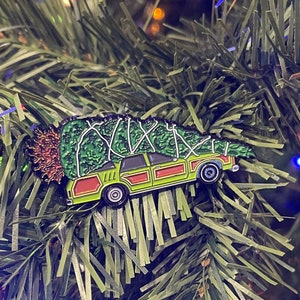 It's the Griswold Family Christmas Tree Wagon Soft Enamel Mashup Pin